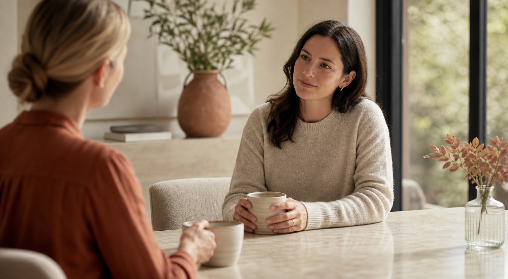 A calm consultation table with warm daylight, suggesting trust before an appointment.